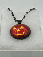 Halloween Grinning Pumpkin Round Glass Cabochon Pendant on Black Metal Chain