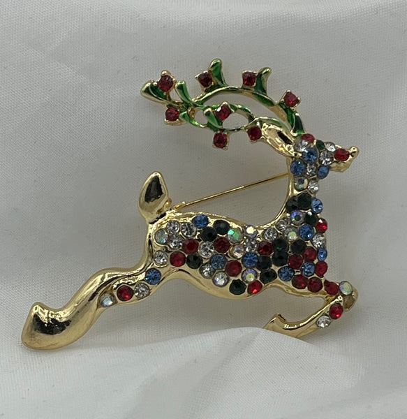 Goldtone Flying Christmas Reindeer Pin Brooch with Red Green Blue and White CZs