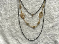 Long Black and Gold Tone Layered Leaf Necklace