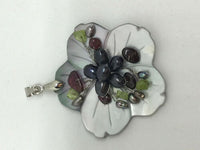 natural black lip shell flower pendant with garnet peridot and pearl