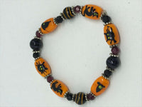 classy halloween lampworked glass cat and witch beaded stretch bracelet