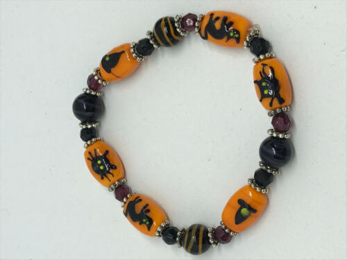 classy halloween lampworked glass cat and witch beaded stretch bracelet